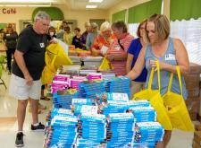 volunteers assembling bags