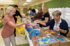 volunteers assembling bags