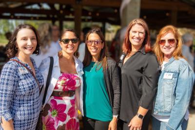 ladies posting at Women United Luncheon 2023