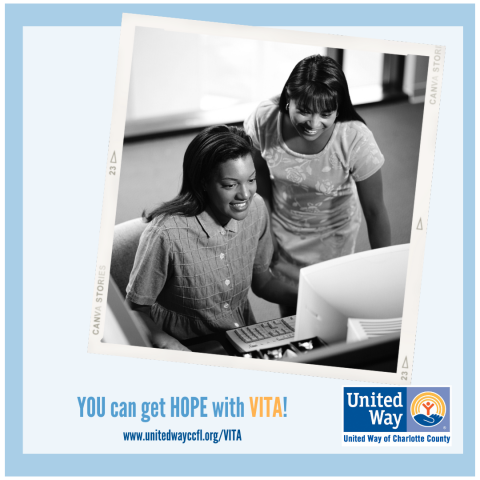 two women, smiling at computer