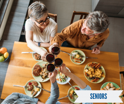 older adults around a dinner table