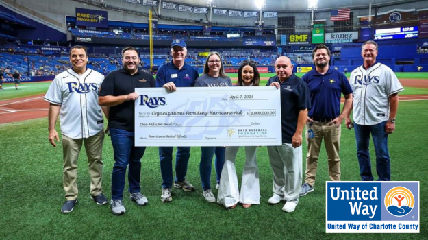 Charlotte County representatives holding million dollar donation check from Rays Baseball Foundation